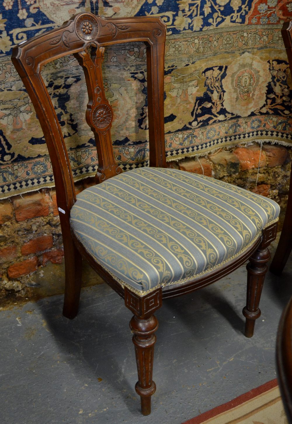 A set of six Victorian Aesthetic period walnut framed side chairs with overstuffed seats (6)