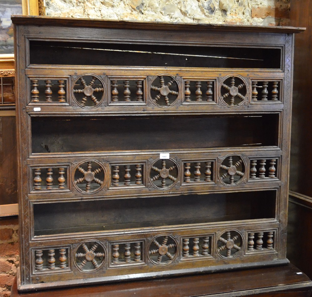 A late 18th century French fruitwood canopy wall shelf