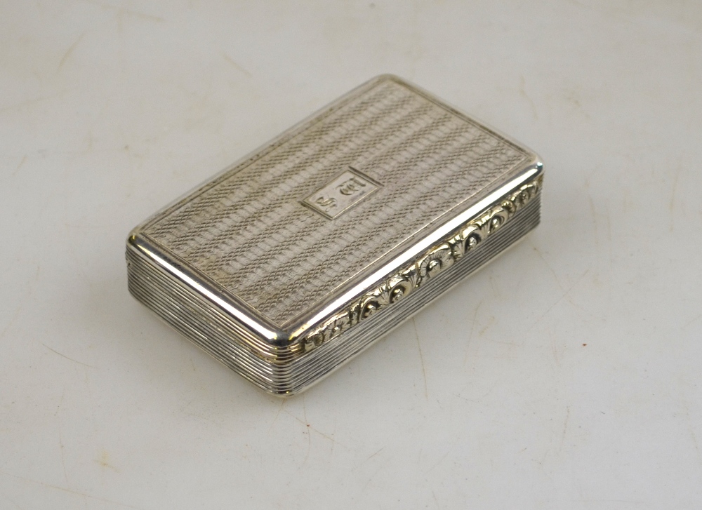 A 19th century engraved snuff box with hinged lid and floral cast thumb-latch, marks obscured