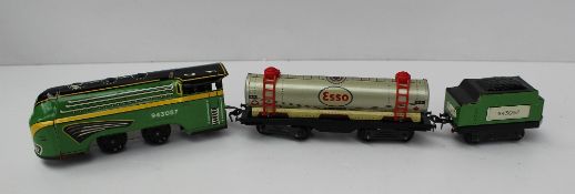 A Brimtoy train set, with a 0-4-0 tin plate locomotive and tender No.943057 together with an Esso