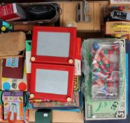 Two "Etch a Sketch" screens together with assorted board games, teaching clocks, jigsaw puzzles,