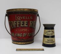 A Cadbury`s dairy milk chocolate tin in the form of a milk churn together with a Rowntree`s cocoa