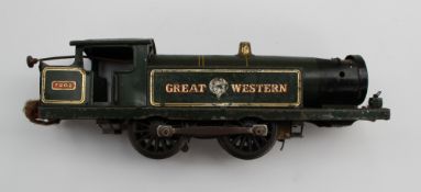 A Hornby O gauge Great Western Locomotive No 7202, together with carriages, signal posts, a tin