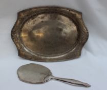 A George V silver dressing table tray of shaped oval form decorated with swags and beads, Birmingham