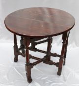 A late 17th Century yew wood drop leaf dining table, the oval top above a single drawer on a gateleg