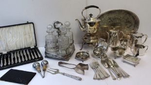 An electroplated kettle on stand together with a tantalus and decanters, sauce boats, tray etc