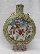 A 19th Century porcelain famille Juene moonflask, the neck and shoulders decorated with flowers,