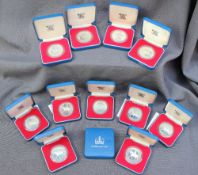 A set of twelve silver crown pieces produced in commemoration of The Queen`s Silver Jubilee (cased)