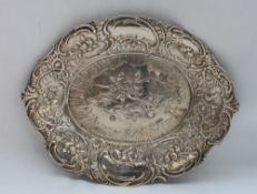 A late Victorian silver dish of oval shape cast with flower heads, scrolls, etc, Import marks,