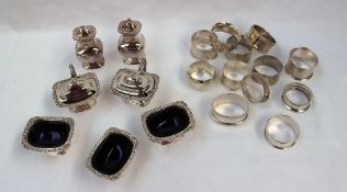 A collection of silver napkin rings together with assorted silver plated cruets approximately 257