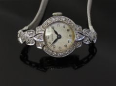 A lady`s white metal cocktail watch the circular dial with Arabic numerals inscribed Corona