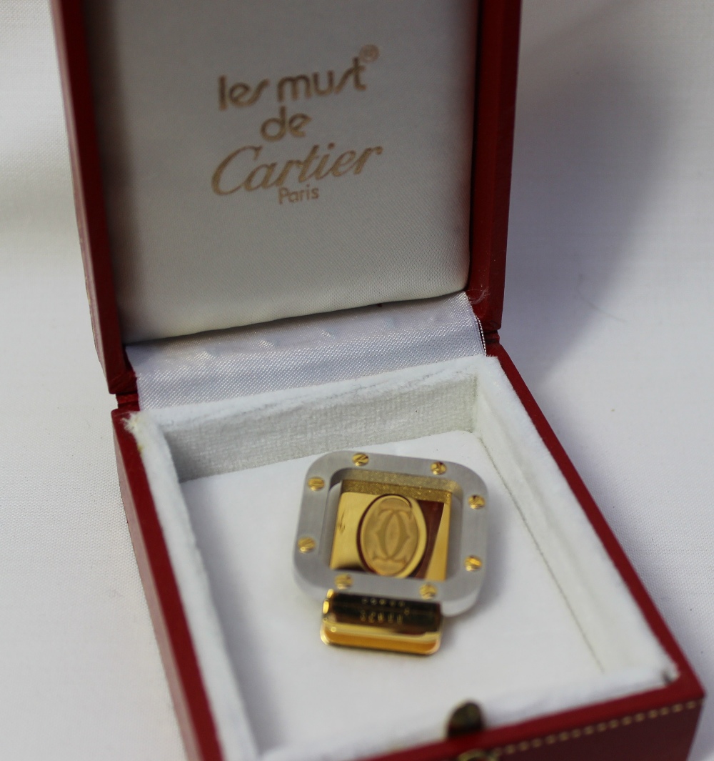A Cartier yellow and white metal money clip, No.25444 (cased)