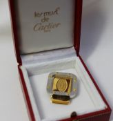 A Cartier yellow and white metal money clip, No.25444 (cased)