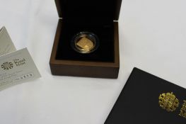 Royal Mint - The 2009 UK Shield of the Royal arms £1 Gold proof coin, No.0379 / 1000, cased and