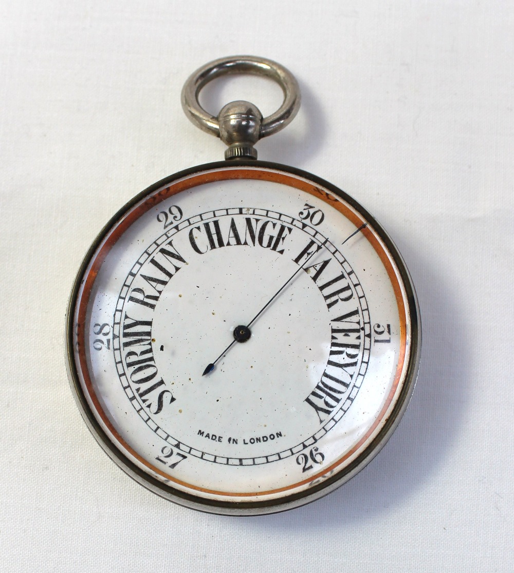 A London made pocket barometer, the white enamel dial with blued steel pointer in a chrome plated - Image 2 of 4