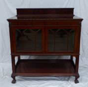 A 20th century mahogany display cabinet, the raised back above a rectangular egg and dart moulded