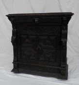 A 19th century oak low countries side cabinet, the rectangular carved top with a single drawer