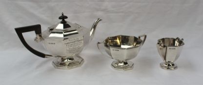 A George V silver three piece teaset, with a panelled body on a spreading foot, Sheffield, 1922,