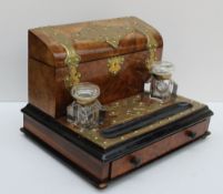 A Victorian walnut desk top standish the brass bound stationery compartment with a sloping fall