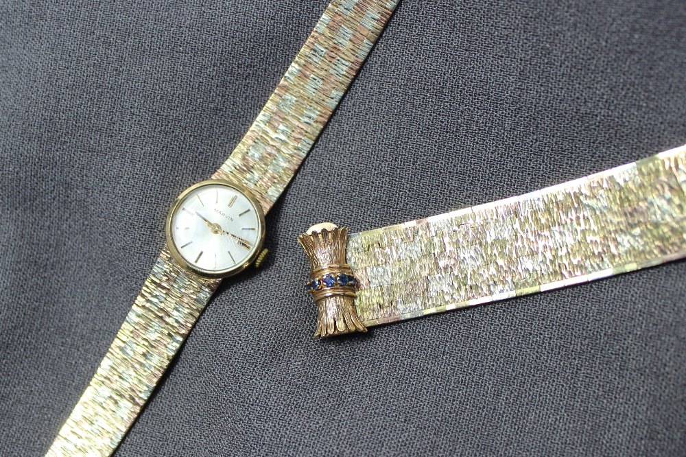 A 9ct yellow gold lady`s wristwatch the silvered dial with batons marked "Marvin" on a three - Image 2 of 3