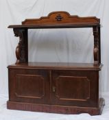 A Victorian mahogany buffet, the raised back above a rectangular moulded top, the base with a pair