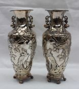 A pair of Chinese white metal vases with gourd handles, the body decorated with birds of paradise,