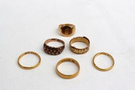 Three 22ct yellow gold wedding bands approximately 8 grams together with an 18ct signet ring and
