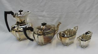 A George V silver four piece tea set of shaped panelled form, comprising hot water pot, teapot,