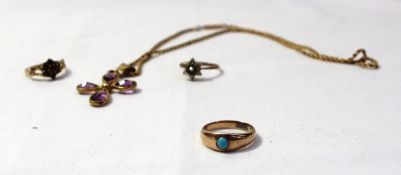 A 9ct yellow gold band set with a cabochon turquoise together with a 9ct yellow gold garnet set