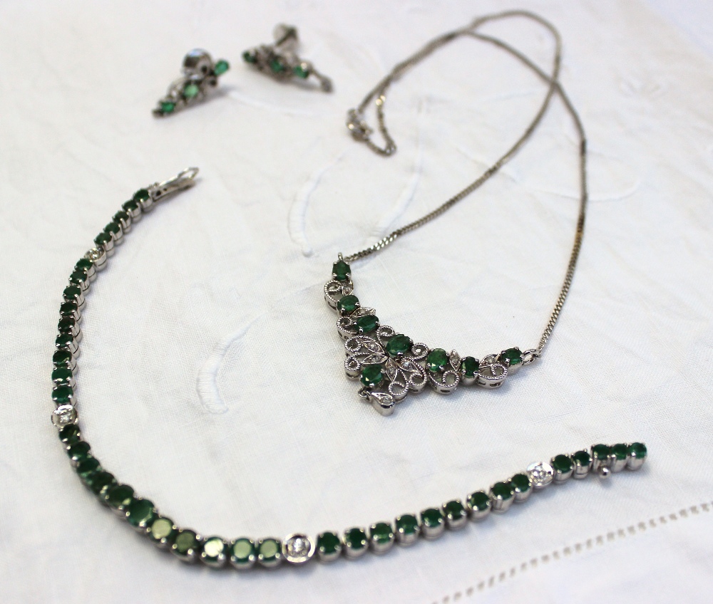 A Suite of emerald and diamond jewellery, including a necklace, a tennis bracelet and a pair of drop