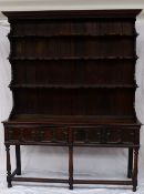 A late 19th / early 20th century oak dresser, the planked rack with four shelves, the base with a