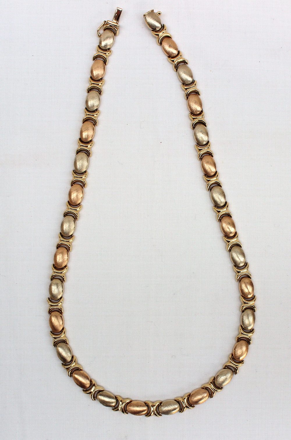 An 18ct yellow gold textured oval and C scroll link necklace, approximately 27 grams - Image 2 of 3