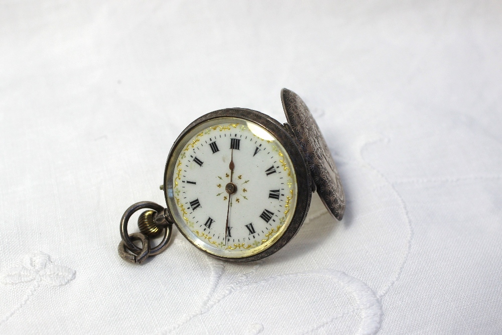 A silver fob watch with an enamel dial and Roman numerals together with another white metal fob - Image 2 of 4