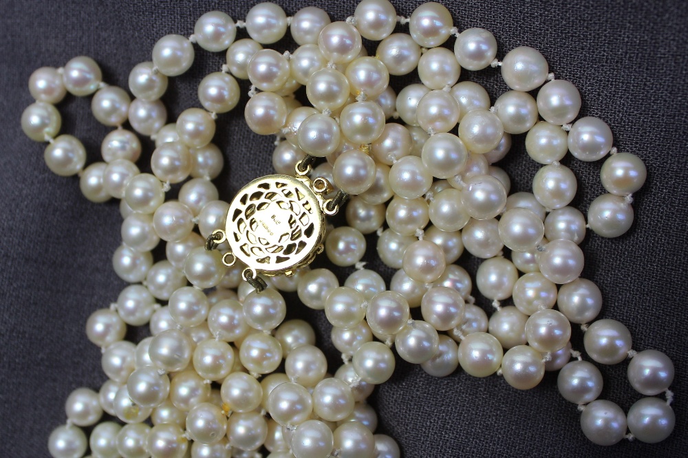 A double string of two hundred and twenty regular spherical pearls individually knotted on a 9ct - Image 3 of 3