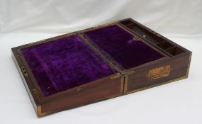 A 19th Century rosewood and brass bound laptop desk, enclosing a sloping fall and inkwells