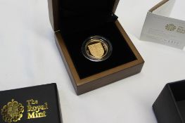 Royal Mint - The 2009 UK Shield of the Royal arms £1 Gold proof coin, No.0377 / 1000, cased and