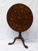 A 19th century continental tripod table, the circular top inlaid with flowers and a bird, the ring