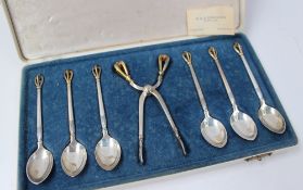 A cased set of Danish parcel gilt tea spoons and Sugar Tongs, of sprung scissor form with Rat tail