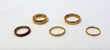 Five 22ct yellow gold wedding bands, approximately 23 grams