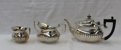 A late Victorian silver three piece teaset, with a fluted body, Birmingham, 1894, approximately