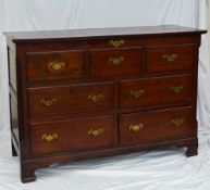 An 18th century and later oak coffer / chest, the hinged rectangular top above three faux drawers,