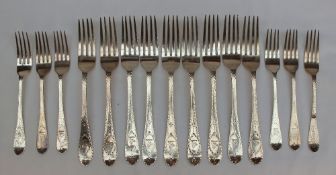 A set of nine Victorian Bright cut silver table forks, London, 1866, Chawner & Co., together with