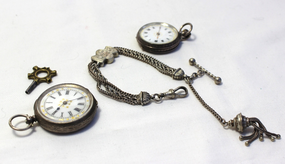 A silver fob watch with an enamel dial and Roman numerals together with another white metal fob - Image 4 of 4