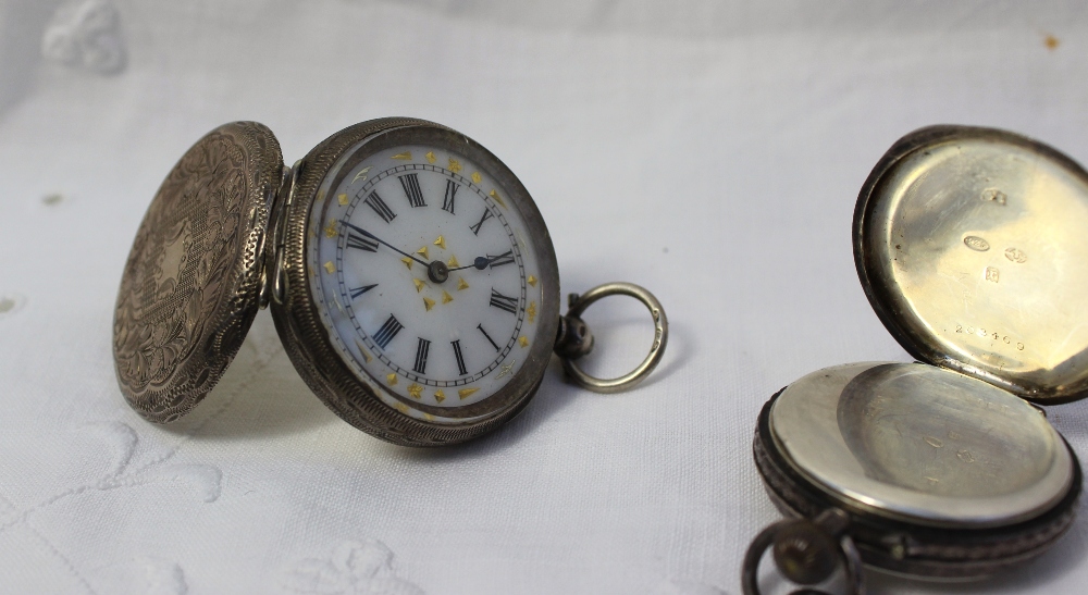 A silver fob watch with an enamel dial and Roman numerals together with another white metal fob - Image 3 of 4