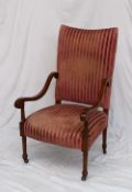 An Edwardian mahogany elbow chair, with an upholstered back and seat with inlaid arms