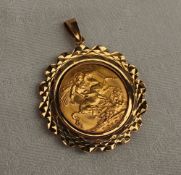 A George V gold sovereign dated 1919, Perth mint mark, in a 9ct yellow gold slip mount