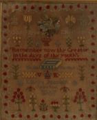 A Victorian woolwork sampler depicting vases of flowers, trees, bible etc by Louisa Peacock, 39 x