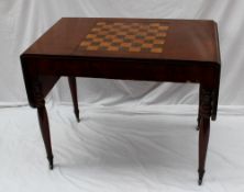 A Victorian mahogany sofa table, the rectangular top with drop flaps and a pull out gaming table