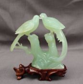 A modern Chinese "jade" carving of a pair of birds on a branch, cased