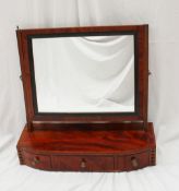 A 19th century mahogany toilet mirror, the rectangular plate between reeded pilasters, the base with